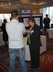 Click on the image to view Carol Sawyers talking to a visitor on our stand at full size in a new window.