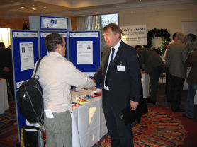 Click on the image to view David Winch talking to a visitor on our stand at full size in a new window