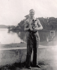 John with a four-legged friend in Rangoon